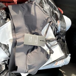 Black NVGTN sports tops